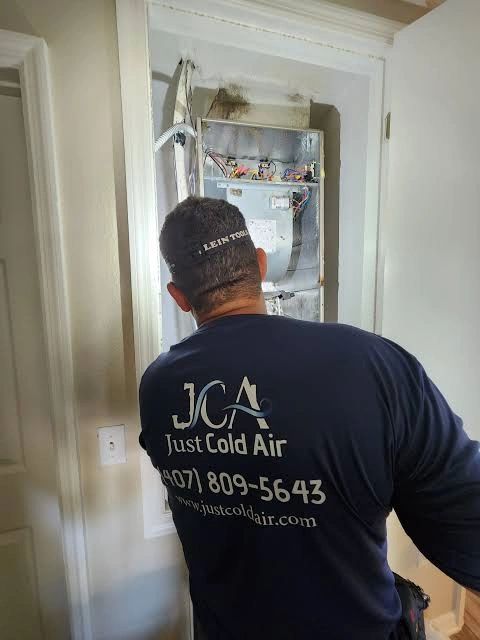 JCA technician servicing indoor air handler