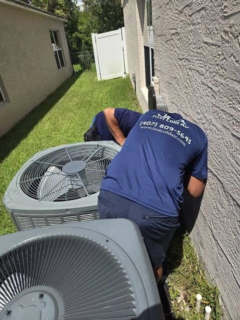 JCA technician servicing condenser unit